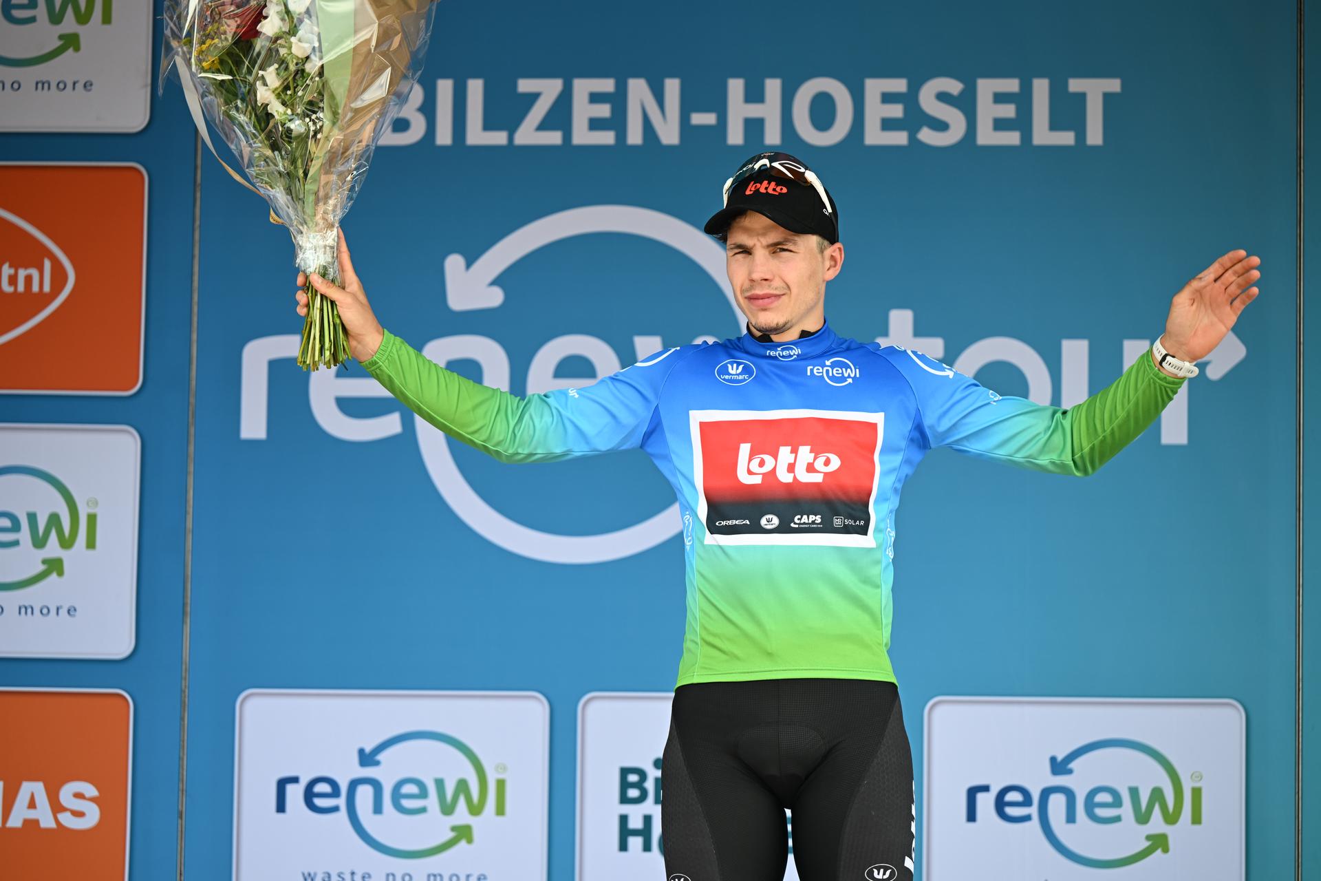 Belgian Arnaud De Lie of Lotto Cycling Team celebrates on the podium of the fourth stage of the 'Renewi Tour' multi-stage cycling race, from Riemst to Bilzen-Hoeselt (196 km) on Saturday 23 August 2025. The five-day race takes place in Belgium and the Netherlands.  BELGA PHOTO DAVID PINTENS