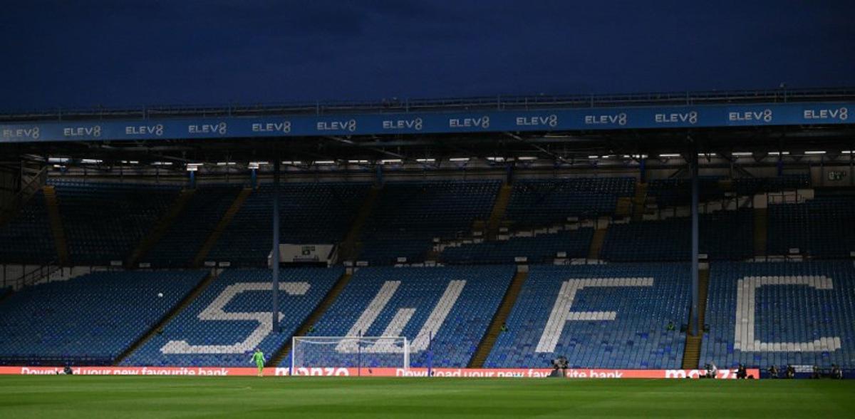 Sheffield Wednesday's US goalkeeper #24 Ethan Horvath takes a kick against empty seats due to a protest against Sheffield Wednesday's Thai owner Dejphon Chansiri during the English League Cup second round football match between Sheffield Wednesday and Leeds United at The Hillsborough Stadium in Sheffield, northern England on August 26, 2025.  Oli SCARFF / AFP