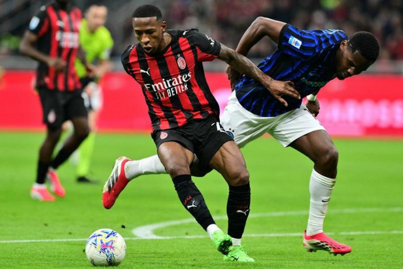 AC Milan's Ecuadorian defender #02 Pervis Estupinan (L) fights for the ball with Inter Milan's French forward #14 Ange-Yoan Bonny during the Italian Serie A football match between AC Milan and Inter Milan at San Siro stadium in Milan, northern Italy, on March 8, 2026.  Stefano RELLANDINI / AFP