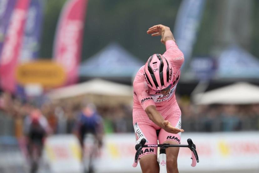 UAE Team Emirates XRG's Mexican rider Isaac Del Toro celebrates as he crosses the finish line to win the 17th stage of the 108th Giro d'Italia cycling race, 155kms from San Michele all'Adige to Bormio, on May 28, 2025.  Luca Bettini / AFP