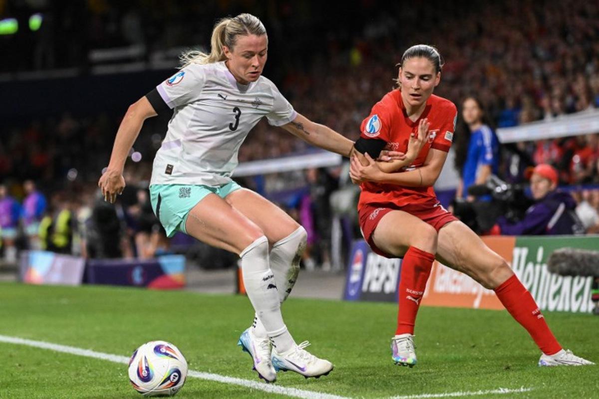 Iceland's forward #03 Sandra Jessen and Switzerland's midfielder #14 Smilla Vallotto fight for the ball during the UEFA Women's Euro 2025 Group A football match between Switzerland and Iceland at the Wankdorf stadium in Bern, on July 6, 2025.  SEBASTIEN BOZON / AFP