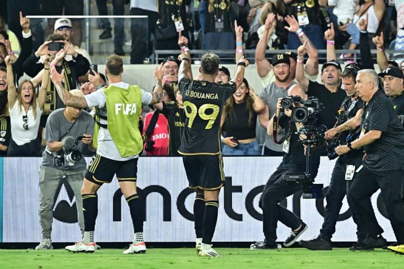 LAFC's Gabonese forward #99 Denis Bouanga celebrates scoring his team's second goal in extra time during a play-in match between LAFC and Club America for the final spot in the 2025 FIFA Club World Cup, at BMO Stadium in Los Angeles, California, on May 31, 2025.   Frederic J. BROWN / AFP