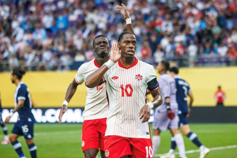 Canada's forward #10 Jonathan David celebrates after scoring a goal during the CONCACAF Gold Cup quarterfinal match between Canada and Guatemala at US Bank Stadium in Minneapolis, Minnesota on June 29, 2025.    Kerem YUCEL / AFP