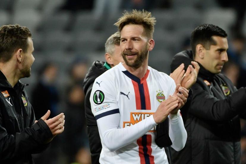 Rapid's Austrian forward #09 Guido Burgstaller (C) acknowledges applause from supporters after the quarter-final Conference League football match 1 of 2, between Djurgarden and SK Rapid Vienna in Stockholm on April 10, 2025. Burgstaller returns to his team following a fractured skull sustained in an attack by an unidentified man in December 2024. Axel NARVING / TT NEWS AGENCY / AFP