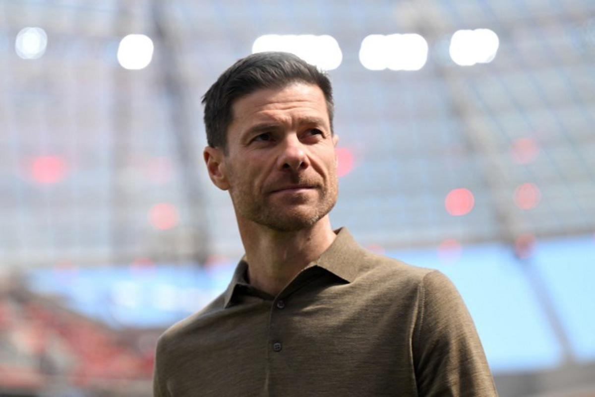 Bayer Leverkusen's Spanish head coach Xabi Alonso arrives prior to the German first division Bundesliga football match between Bayer 04 Leverkusen and FC Augsburg in Leverkusen, western Germany on April 26, 2025.  INA FASSBENDER / AFP