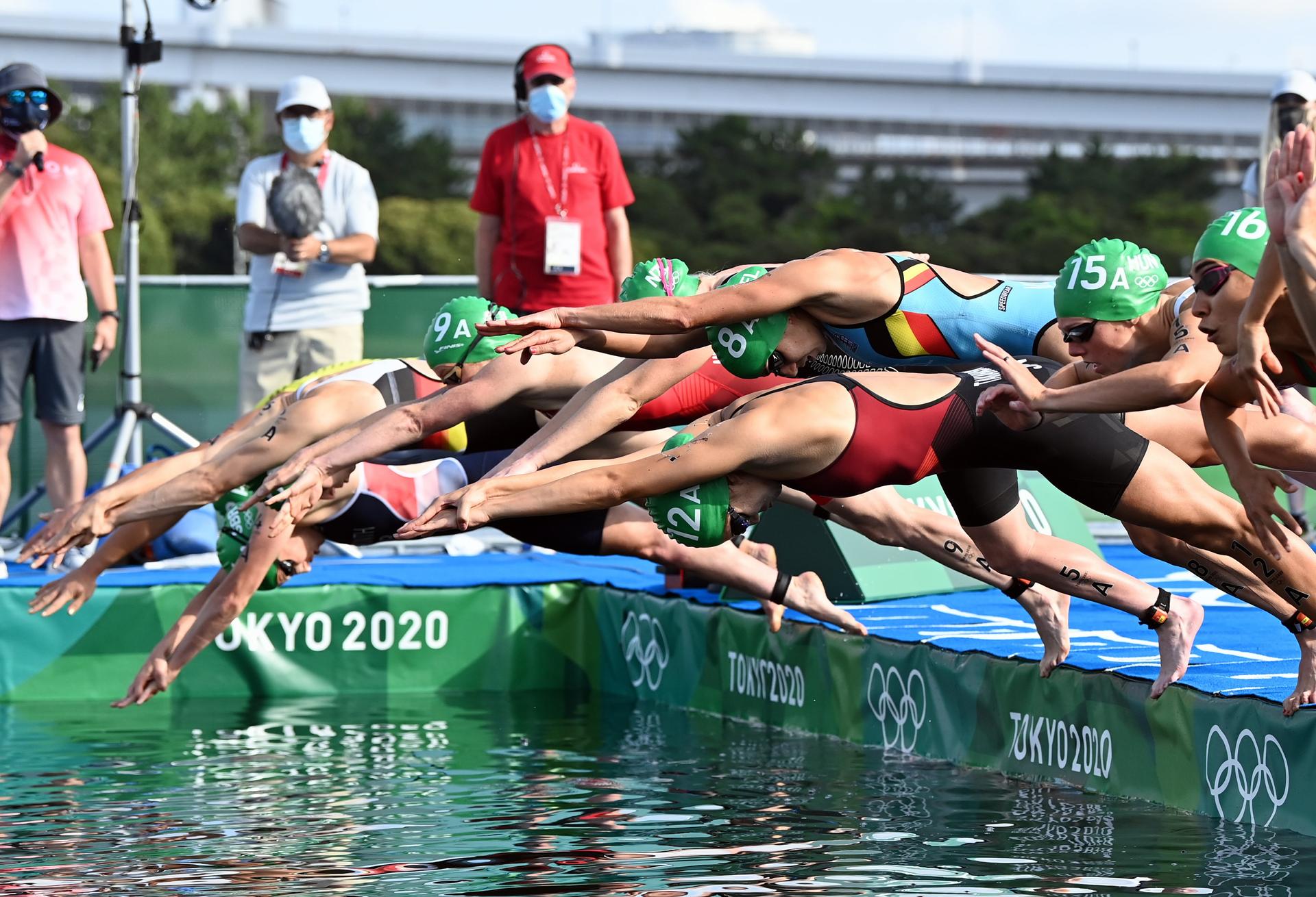 Belgian Claire Michel and (Cap 8A) pictured in action during the swimming part of the triathlon mixed relay race on the ninth day of the 'Tokyo 2020 Olympic Games' in Tokyo, Japan on Saturday 31 July 2021. The postponed 2020 Summer Olympics are taking place from 23 July to 8 August 2021. BELGA PHOTO ROB WALBERS