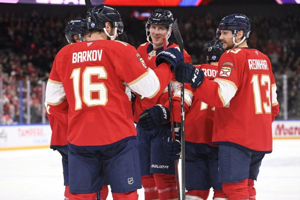Dmitry Kulikov, Aleksander Barkov,  Niko Mikkola (77), Evan Rodrigues and Sam Reinhart (13) of Florida celebrate the opening 0-1 goal by Rodrigues during the NHL Global Series Ice Hockey match Dallas Stars vs Florida Panthers in Tampere, Finland on November 2, 2024.  Heikki Saukkomaa / Lehtikuva / AFP