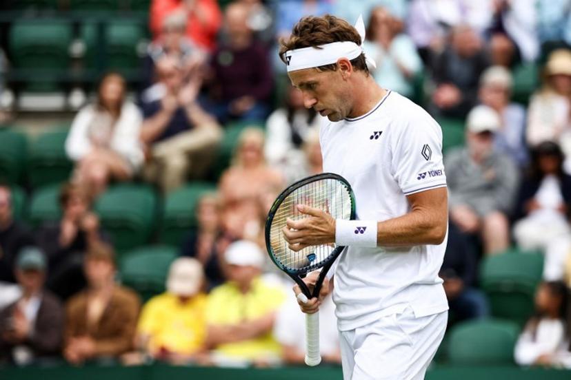 Norway's Casper Ruud reacts as he plays against Australia's Alex Bolt during their men's singles tennis match on the first day of the 2024 Wimbledon Championships at The All England Lawn Tennis and Croquet Club in Wimbledon, southwest London, on July 1, 2024.  HENRY NICHOLLS / AFP