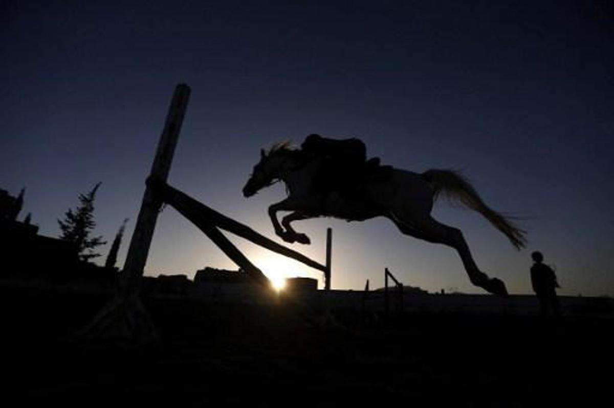 A Yemeni boy competes in the National Horse Jumping Championships in Sanaa on January 9, 2017. 
Mohammed HUWAIS / AFP