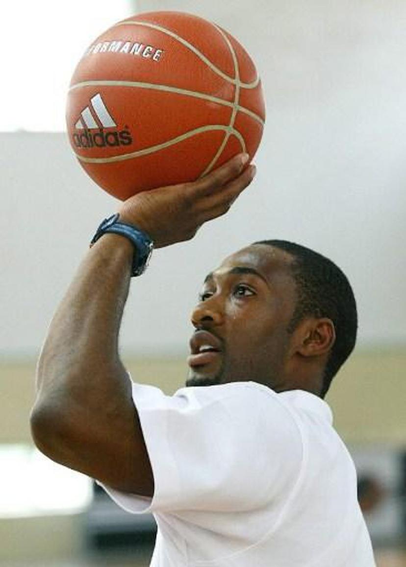 Gilbert Arenas of the NBA Washington Wizards team ahead of a training session of the Adidas Basketball Superstar Camp in Shanghai, 20 May 2004. The camp features NBA players and professional coaches from the US, Europe and China to develop future generations of Basketball superstars. Fifty elite youth basketball players from China, Hong Kong, Australia, Philippines, Korea, Chinese Taipei, Singapore participate the four-day training event. AFP PHOTO/LIU Jin