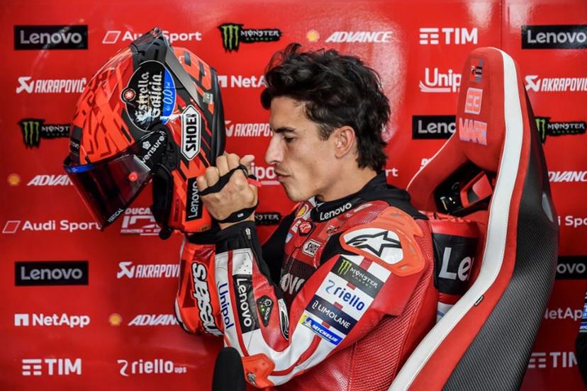Ducati Lenovo Team's Marc Marquez puts on his helmet prior to the Practice session at the Balaton Park Circuit in Balatonfokajar, Hungary, on June 5, 2026, ahead of the Hungarian Motorcycle MotoGP Grand Prix.   FERENC ISZA / AFP