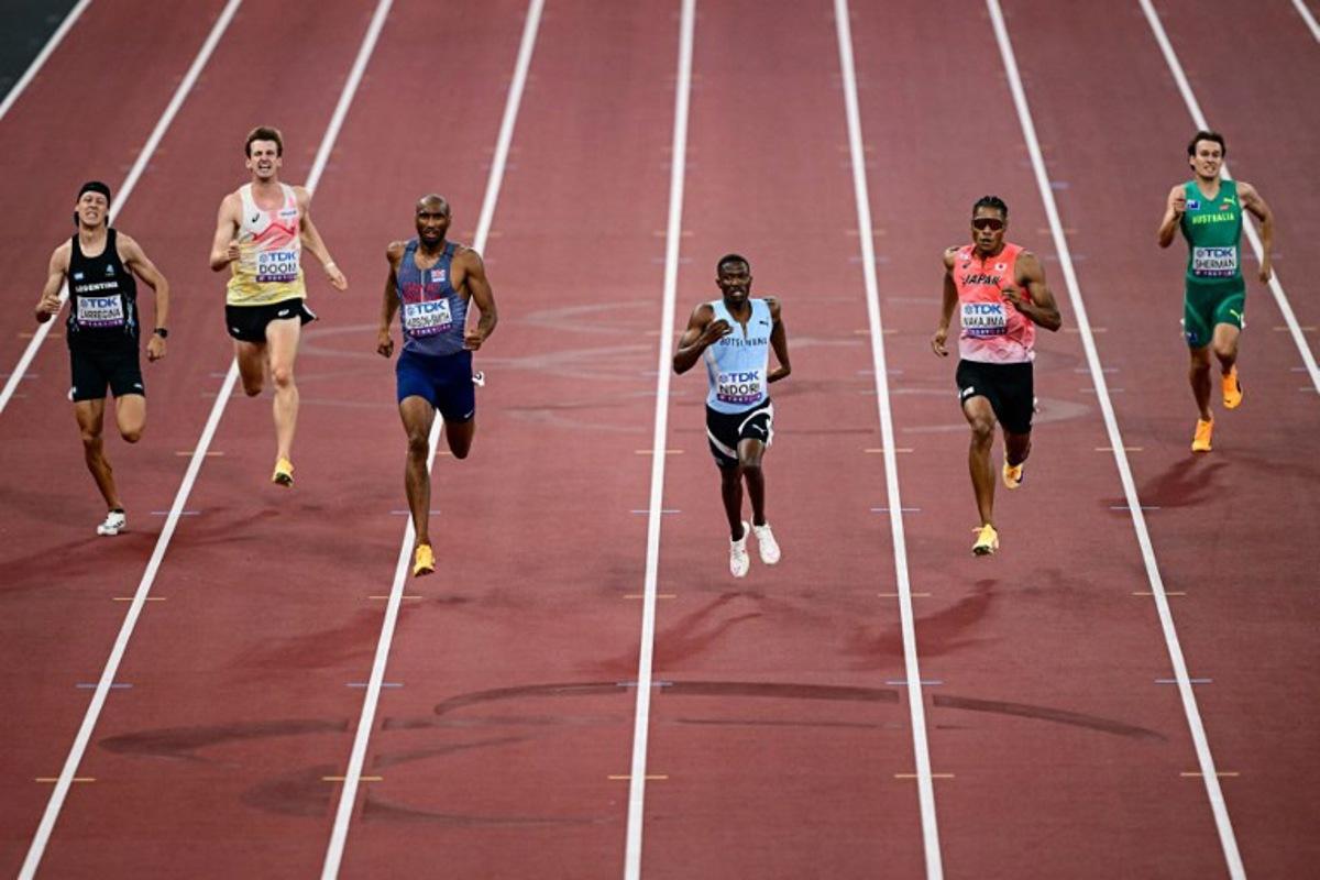 (From L) Argentina's Elian Larregina, Belgium's Alexander Doom, Great Britain's Matthew Hudson-Smith, Botswana's Bayapo Ndori, Japan's athlete Yuki Joseph Nakajima and Australia's athlete Cooper Sherman compete in the men's 400m heats during the World Athletics Championships in Tokyo on September 14, 2025.  Yuichi YAMAZAKI / AFP