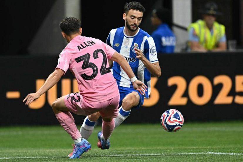 Inter Miami's US defender #32 Noah Allen tackles FC Porto's Portuguese defender #23 Joao Mario leading to a penalty during the FIFA Club World Cup 2025 Group A football match between US Inter Miami and Portugal's FC Porto at the Mercedes-Benz stadium in Atlanta on June 19, 2025.  Paul ELLIS / AFP