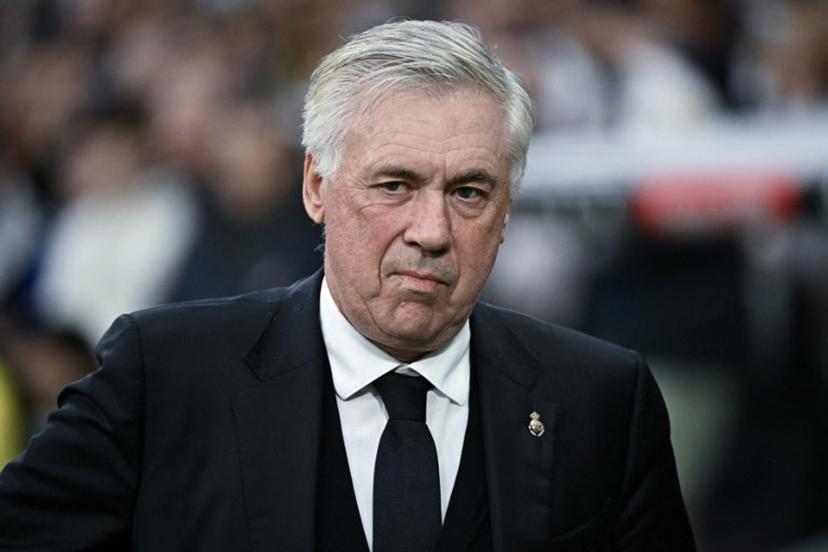 Real Madrid's Italian coach Carlo Ancelotti looks on before the Spanish league football match between Real Madrid CF and Valencia CF at the Santiago Bernabeu stadium in Madrid on April 5, 2025.  JAVIER SORIANO / AFP