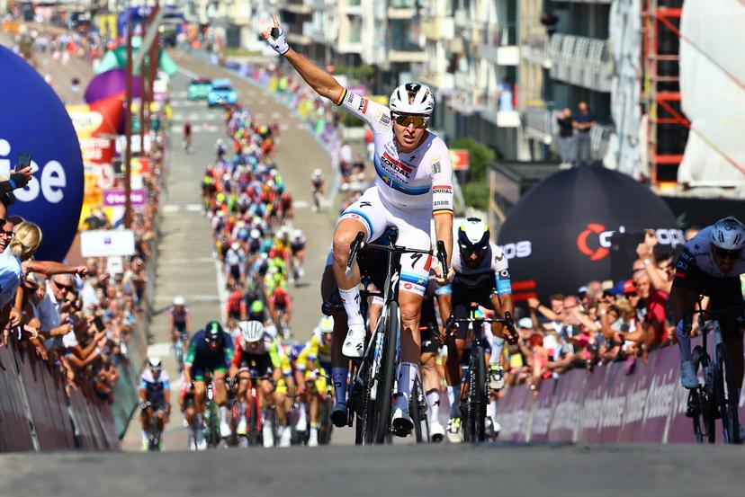 Belgian Jasper Philipsen of Alpecin-Deceuninck celebrates as he crosses the finish line to win the first stage of the Baloise Belgium Tour cycling race, 198km from Merelbeke-Melle to Knokke-Heist, Wednesday 18 June 2025. The Baloise Belgium Tour takes place from 18 to 22 June. BELGA PHOTO DAVID PINTENS