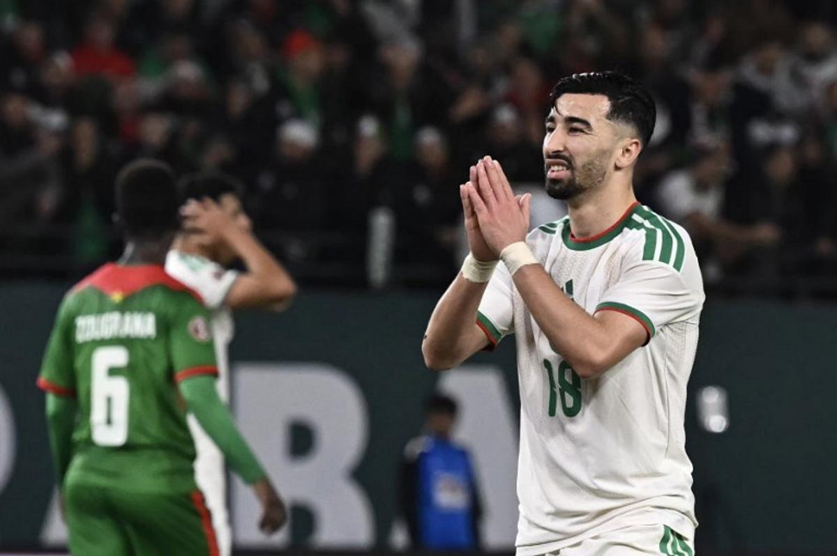Algeria's forward #18 Mohamed Amoura (R) gestures during the Africa Cup of Nations (CAN) Group E football match between Algeria and Burkino Faso at Moulay Hassan Stadium in Rabat on December 28, 2025.   Paul ELLIS / AFP