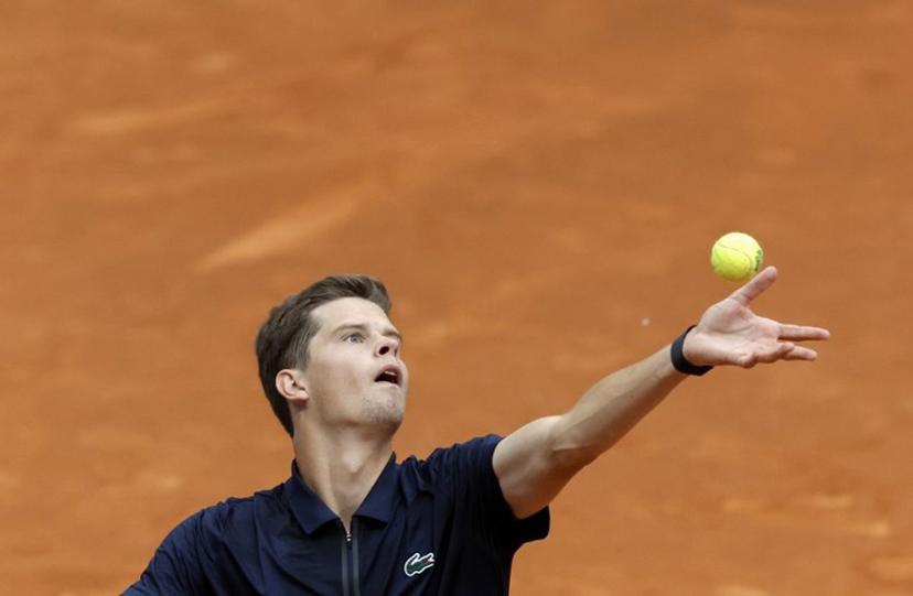 Belgium's Alexander Blockx serves to Argentinia's Juan Manuel Cerundolo during their 2026 ATP Tour Madrid Open tennis tournament singles match at the Caja Magica in Madrid, on April 28, 2026.  OSCAR DEL POZO / AFP
