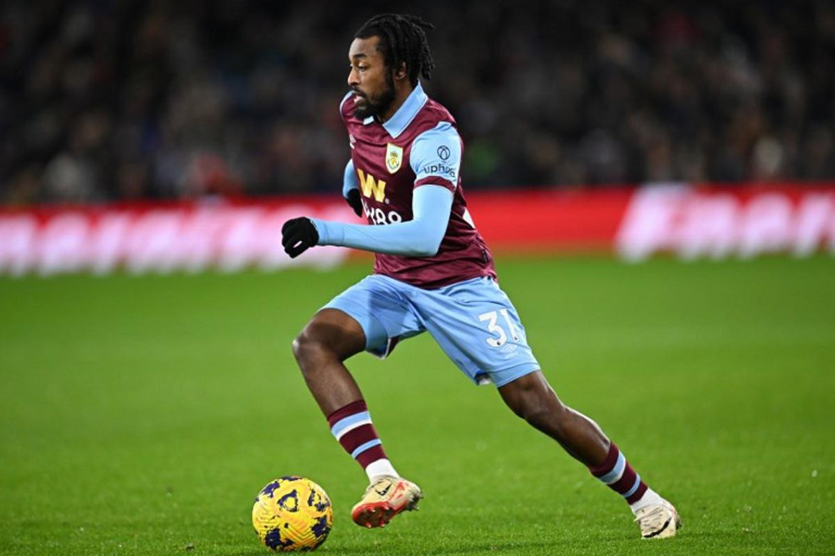 Burnley's Belgian midfielder #31 Mike Tresor runs with the ball during the English Premier League football match between Burnley and Liverpool at Turf Moor in Burnley, north-west England on December 26, 2023.  Paul ELLIS / AFP