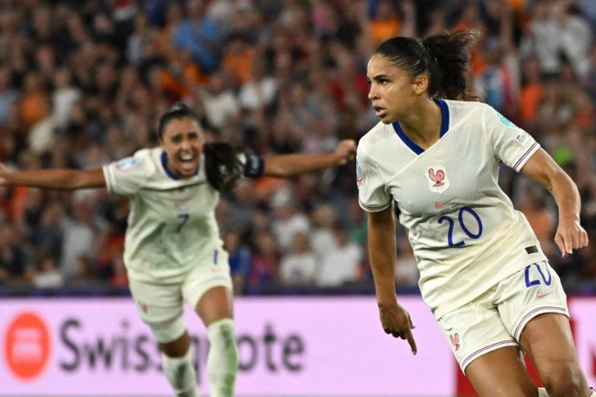 France's forward #20 Delphine Cascarino (R) celebrates after scoring France's third goal during the UEFA Women's Euro 2025 Group D football match between The Netherlands and France at the St. Jakob-Park Stadium in Basel, on July 13, 2025.  Miguel MEDINA / AFP
