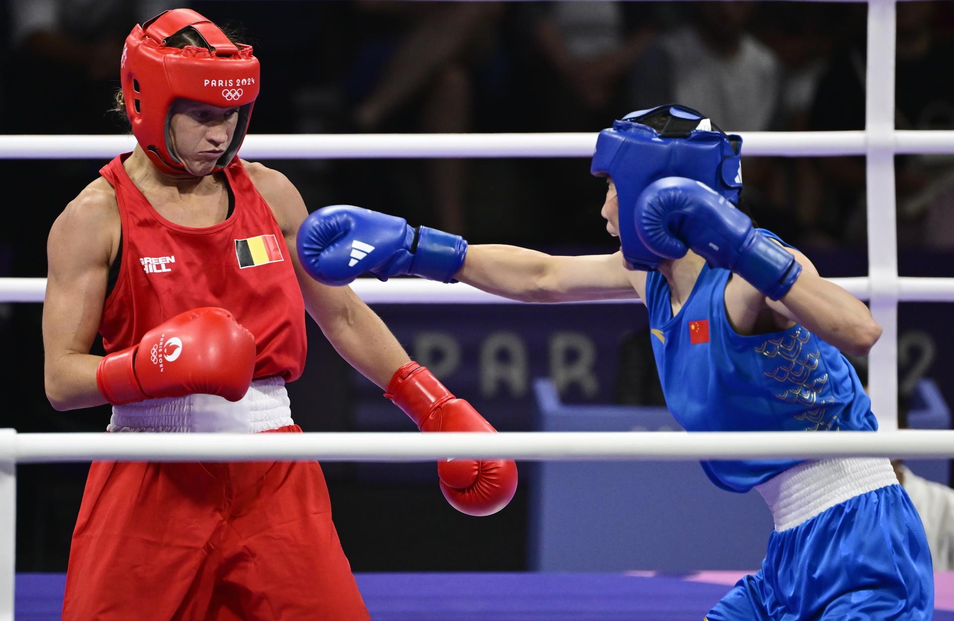 Chinese boxer Liu Yang (blue) and Belgian boxer Oshin Derieuw (red) pictured in action during a boxing bout between Belgian Derieuw and Chinese Yang, in the quarterfinal of the women's -66kg category at the Paris 2024 Olympic Games, on Saturday 03 August 2024 in Paris, France. The Games of the XXXIII Olympiad are taking place in Paris from 26 July to 11 August. The Belgian delegation counts 165 athletes competing in 21 sports. BELGA PHOTO DIRK WAEM