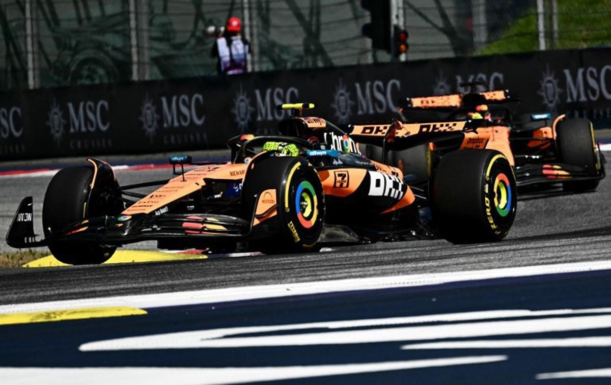 McLaren's British driver Lando Norris drives ahead of team mate McLaren's Australian driver Oscar Piastri at the start of the Formula One Austrian Grand Prix at the Red Bull Ring race track in Spielberg, Austria, on June 29, 2025.  Joe Klamar / AFP