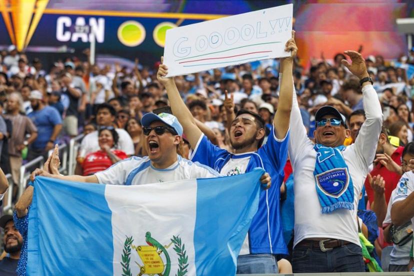 Guatemala fans celebrate after their team won the CONCACAF Gold Cup quarterfinal match against Canada in a penalty shootout at US Bank Stadium in Minneapolis, Minnesota on June 29, 2025.  Kerem YUCEL / AFP