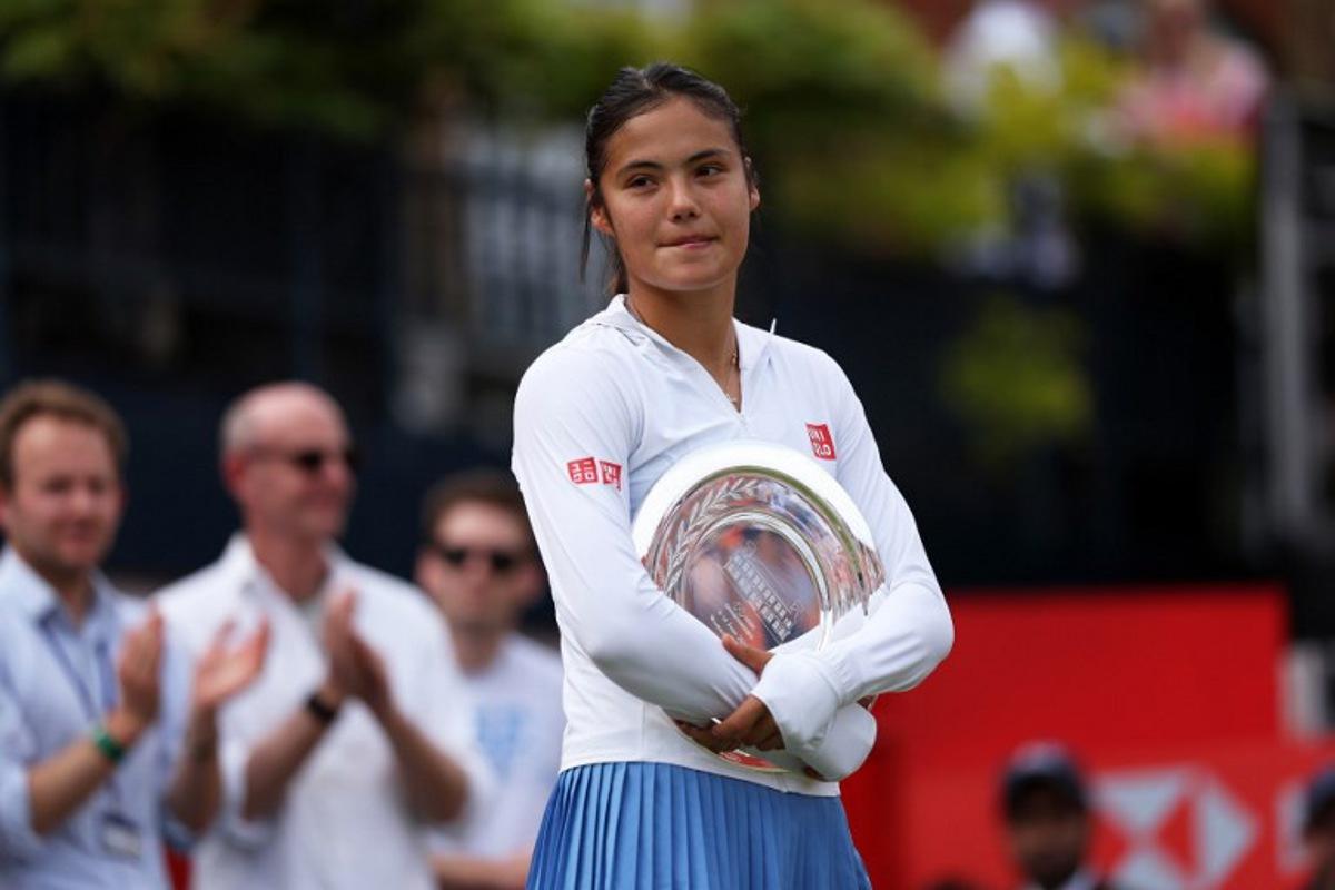 Britain's Emma Raducanu stands with the runners up trophy following her loss to Croatia's Donna Vekic after their women's singles final tennis match at the HSBC WTA Championships at Queen's Club in west London on June 14, 2026.  Adrian Dennis / AFP