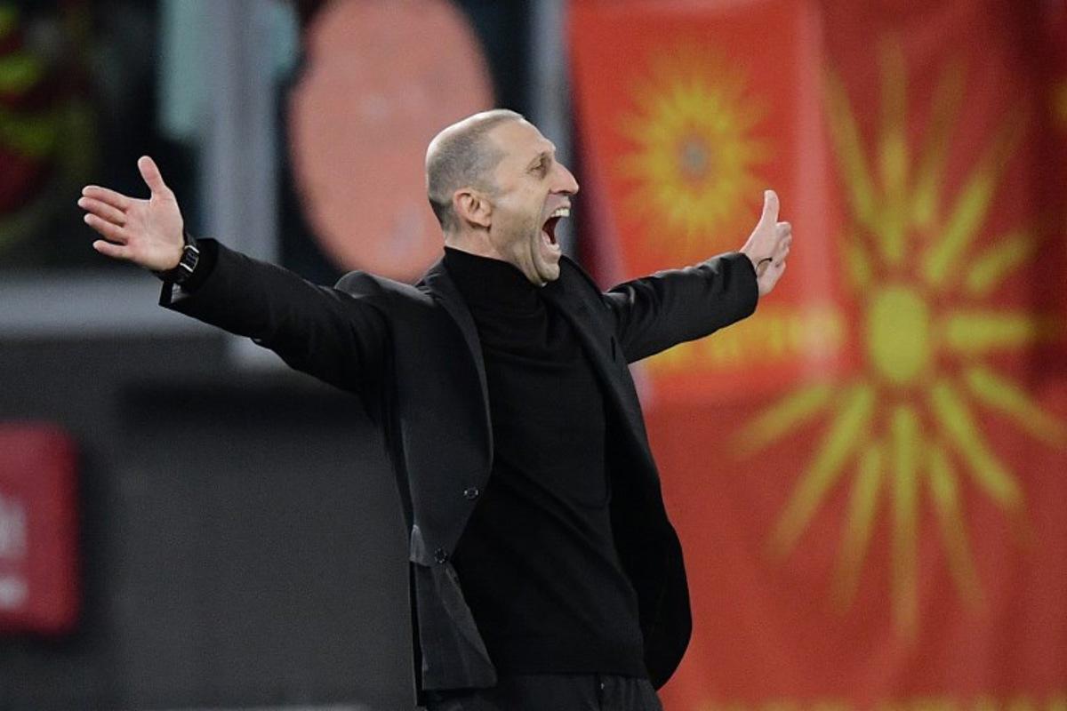 North Macedonia 's coach Blagoja Milevski celebrates the team's second goal during the UEFA Euro 2024 qualifying Group C football match between Italy and North Macedonia at the Olympic Stadium in Rome on November 17, 2023.  Filippo MONTEFORTE / AFP