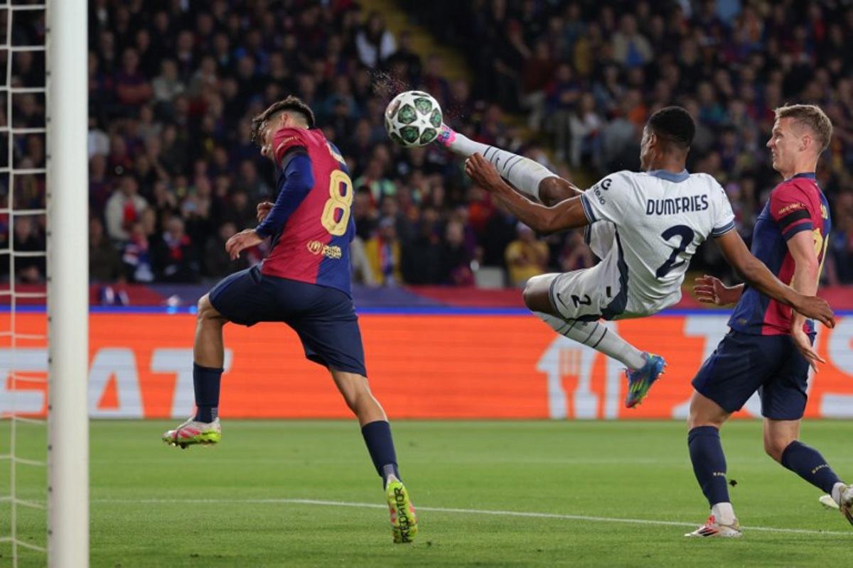 Inter Milan's Dutch defender #02 Denzel Dumfries scores his team's second goal during the UEFA Champions League semi final first leg football match between FC Barcelona and Inter Milan at the Estadi Olimpic Lluis Companys in Barcelona on April 30, 2025.  LLUIS GENE / AFP