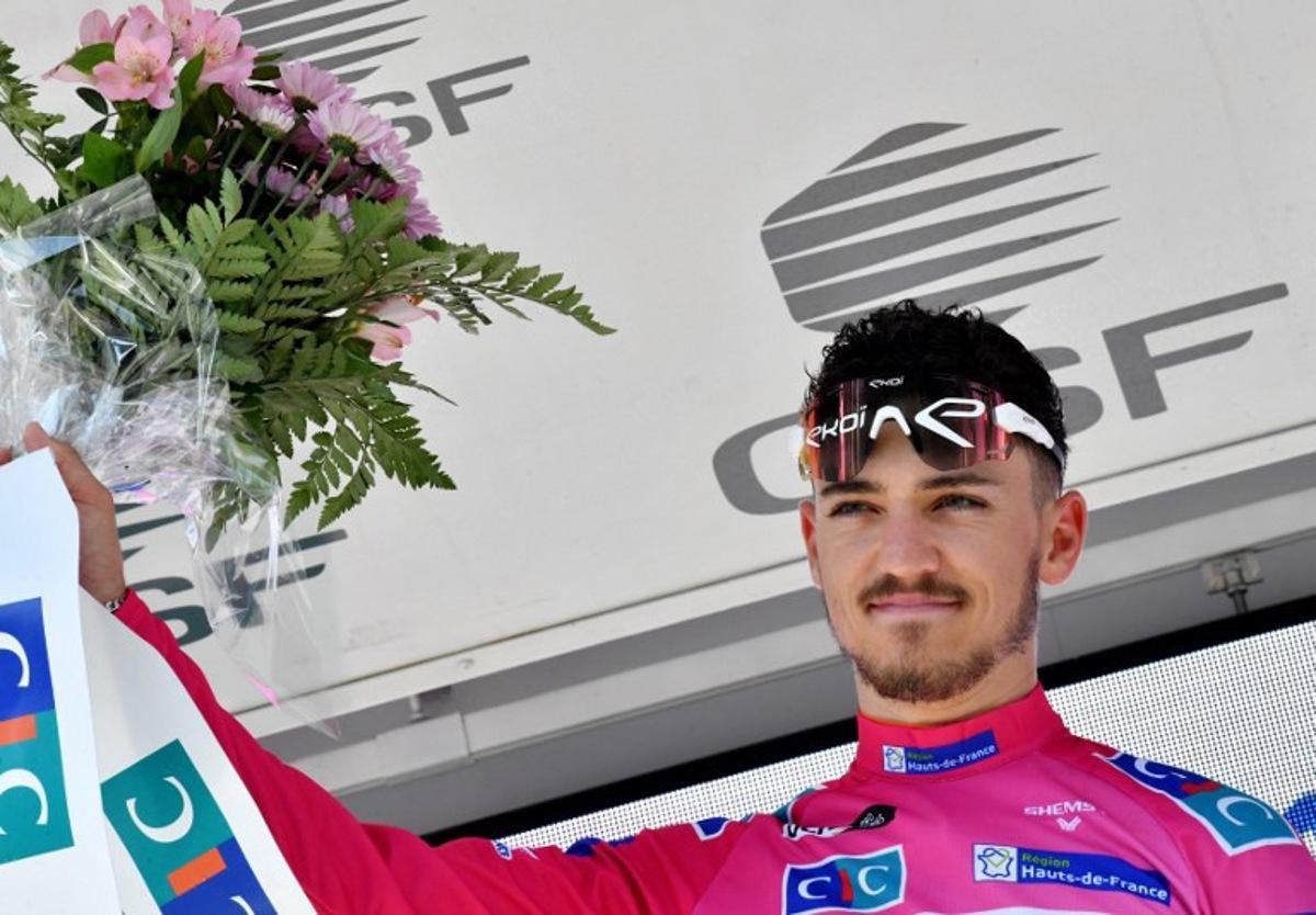 Team St Michel-Auber 93's Jason Tesson of France celebrates on the podium after winning the second stage of the "4 jours de Dunkerque" (Four days of Dunkirk) cycling race and taking the lead in the general classification, in Maubeuge, Northern France, on May 4, 2022.  FRANCOIS LO PRESTI / AFP