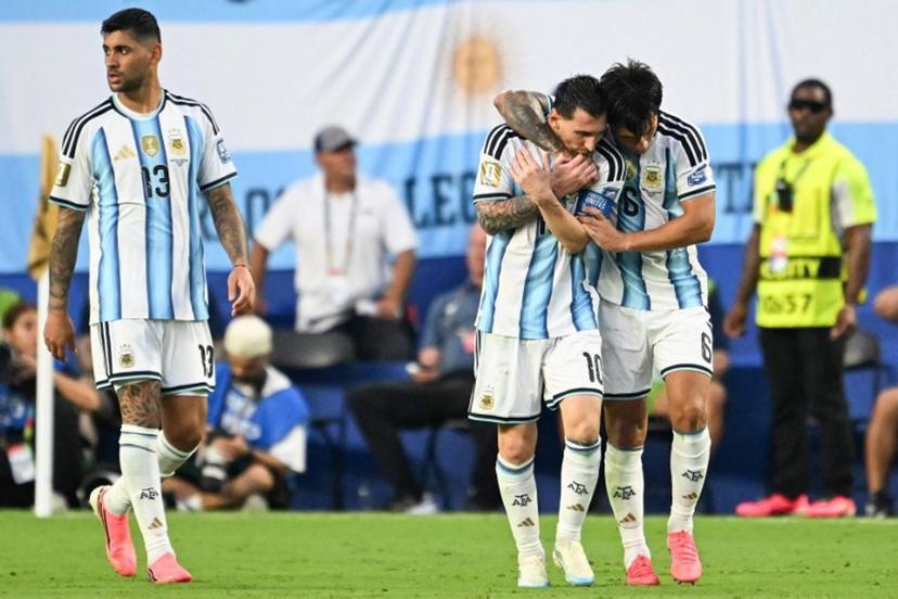 Argentina's defender #06 Lisandro Martinez celebrates with teammate Argentina's forward #10 Lionel Messi scoring his team's second goal next to Argentina's defender #13 Cristian Romero during the 2026 World Cup round of 32 football match between Argentina and Cape Verde at the Miami Stadium in Miami Gardens on July 3, 2026.   ROBERTO SCHMIDT / AFP