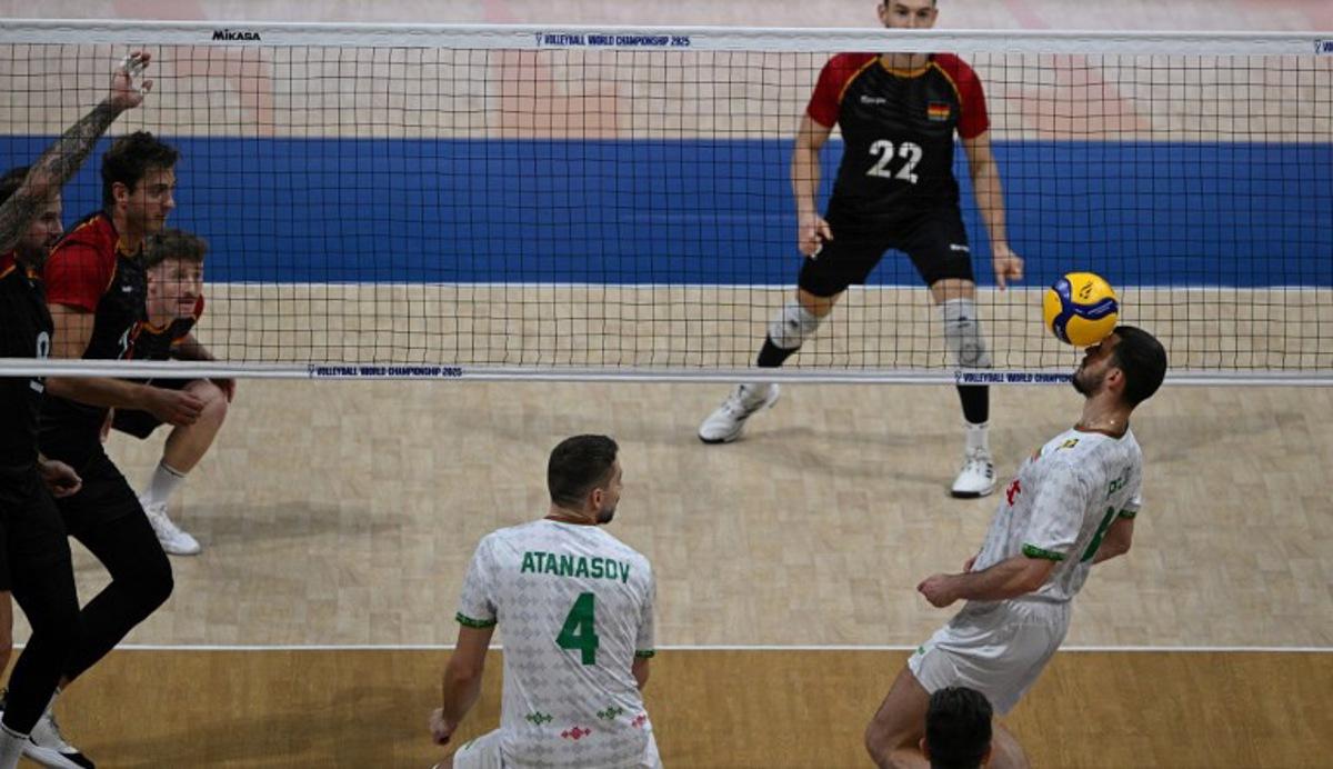 Lliya Petkov (R) of Bulgaria controls the ball against Germany during their match at the Volleyball Men's World championship in Manila on September 13, 2025.   Ted ALJIBE / AFP