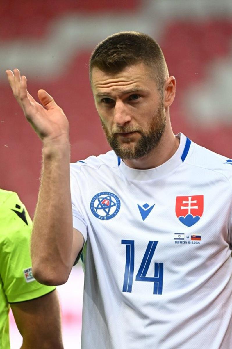Slovakia's defender #14 Milan Skriniar stands for the national anthems prior to the international friendly football match between Israel and Slovakia in Debrecen on June 10, 2025.  Attila KISBENEDEK / AFP