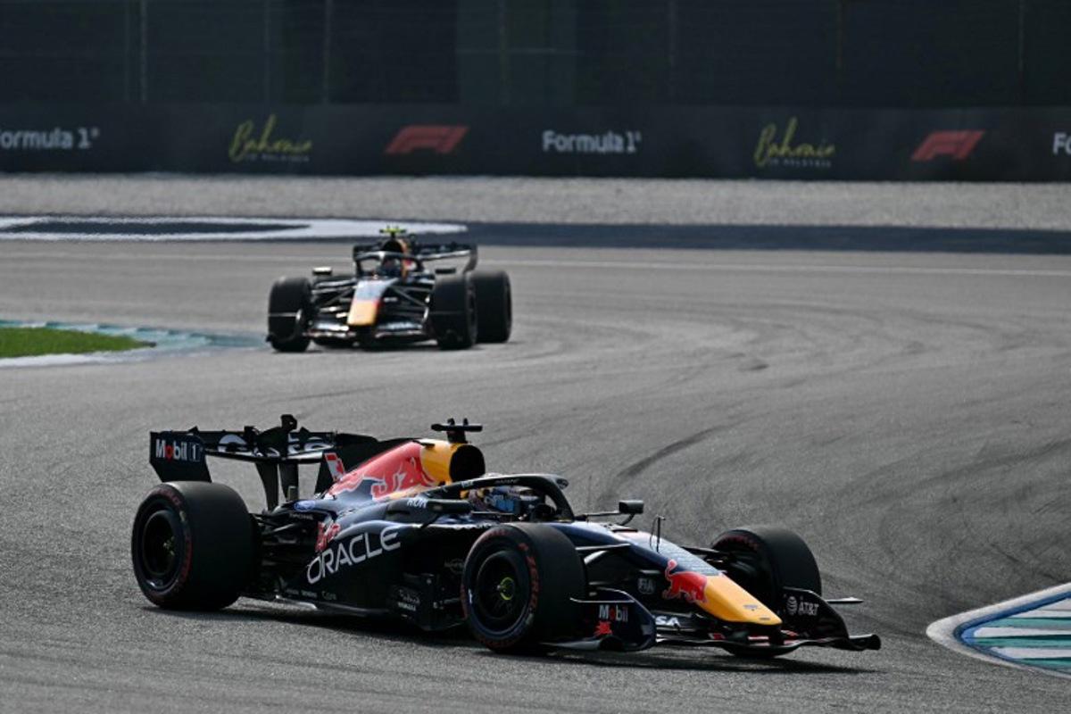 Red Bull Racing's Dutch driver Max Verstappen (front) and Red Bull Racing's French driver Isack Hadjar drive during the qualifying session of the Formula One Bahrain Grand Prix in Sepang on October 3, 2026.  Lillian SUWANRUMPHA / AFP