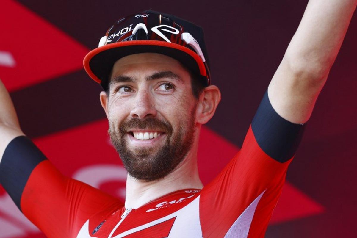 Team Lotto's Belgian rider Thomas De Gendt celebrates on the podium after winning the 8th stage of the Giro d'Italia 2022, 153 kilometers between Napoli and Napoli, southwestern Italy, on May 14, 2022.  Luca Bettini / AFP