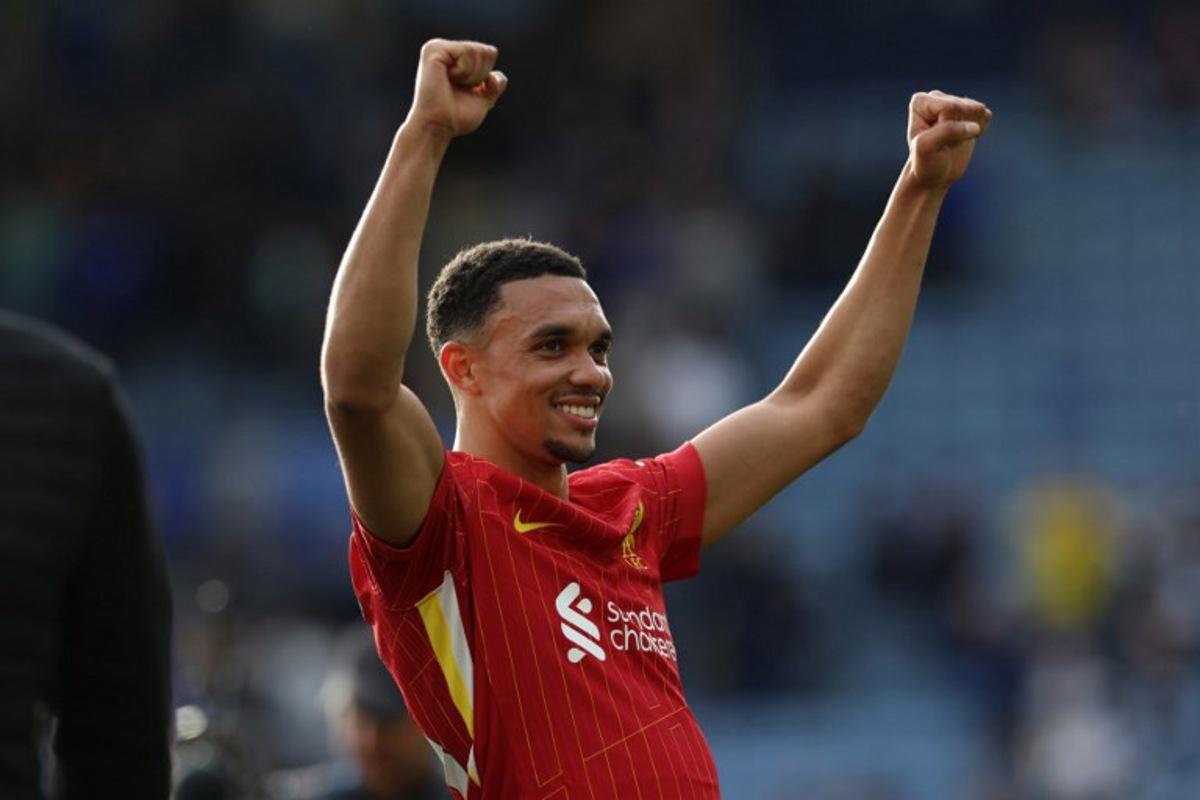 Liverpool's English defender #66 Trent Alexander-Arnold celebrates on the pitch after the English Premier League football match between Leicester City and Liverpool at King Power Stadium in Leicester, central England on April 20, 2025. Leicester were relegated from the Premier League after a 1-0 defeat to Liverpool. Darren Staples / AFP