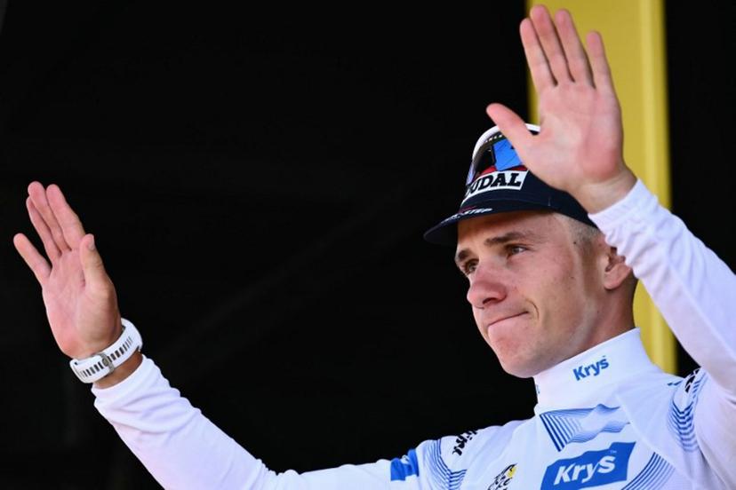 Soudal Quick-Step team's Belgian rider Remco Evenepoel celebrates on the podium with the best young rider's white jersey after the 13th stage of the 112th edition of the Tour de France cycling race, 10.9 km individual time trial between Loudenvielle and Peyragudes, in the Pyrenees mountains of southwestern France, on July 18, 2025.  Marco BERTORELLO / AFP