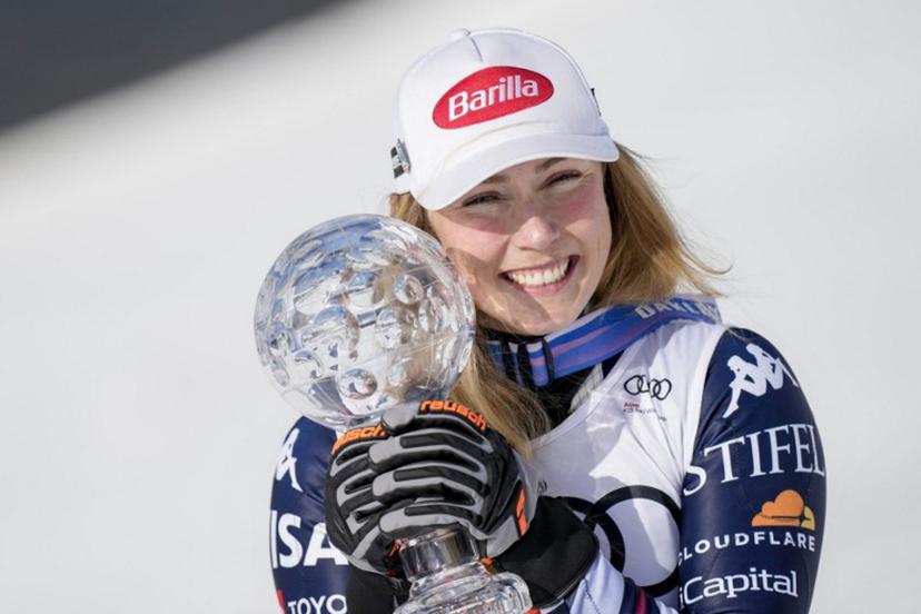 USA's Mikaela Shiffrin poses with her crystal globe trophy for overall Slalom World Cup leader after the women's FIS Ski World Cup slalom race, in which she placed first, too, in Kvitfjell, near Lillehammer, Norway on March 24, 2026.  Cornelius Poppe / NTB / AFP
