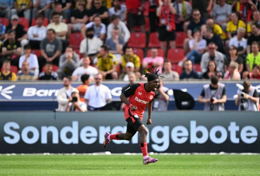Bayer Leverkusen's Dutch defender #30 Jeremie Frimpong celebrates his 1-0 during the German first division Bundesliga football match between Bayer 04 Leverkusen and Borussia Dortmund in Leverkusen, western Germany, on May 11, 2025.  INA FASSBENDER / AFP
