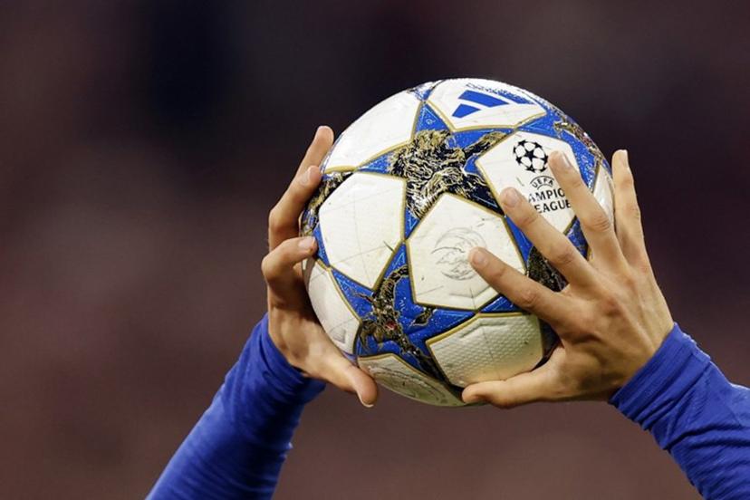 Chelsea's Spanish defender #03 Marc Cucurella holds the official Champions League matchball during the UEFA Champions League football match between FC Bayern Munich and Chelsea FC in Munich, southern Germany on September 17, 2025.  Alexandra BEIER / AFP