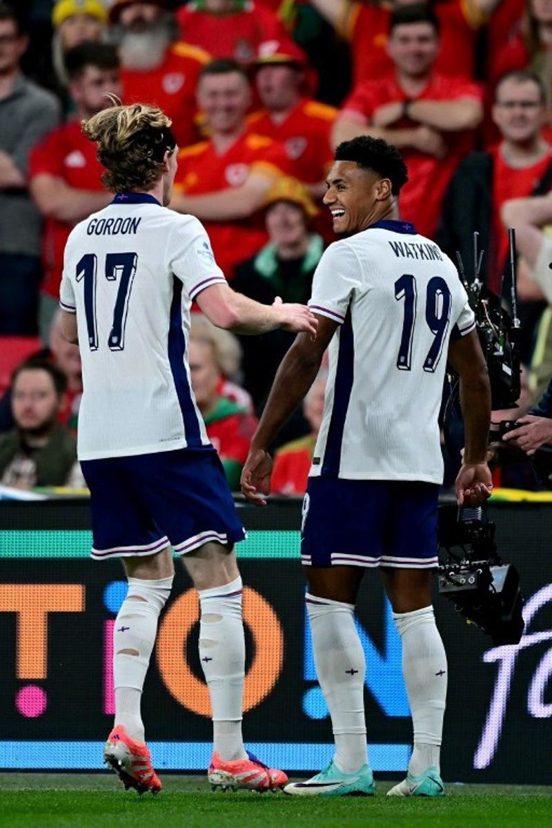 England's striker Ollie Watkins (R) celebrates scoring the team's second goal during the friendly football match between England and Wales at Wembley Stadium in London on October 9, 2025.   Ben STANSALL / AFP