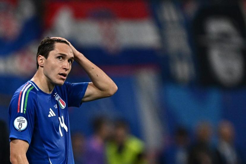 Italy's forward #14 Federico Chiesa reacts during the UEFA Euro 2024 Group B football match between Croatia and Italy at the Leipzig Stadium in Leipzig on June 24, 2024.  GABRIEL BOUYS / AFP