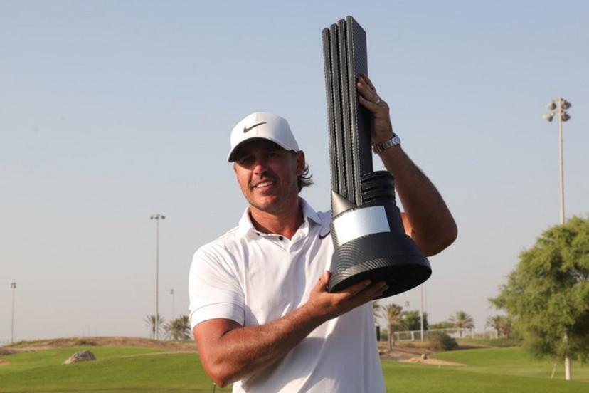 Brooks Koepka of the US celebrates his trophy after winning the 2023 LIV Golf Jeddah champion at Royal Greens Golf in Jeddah on October 15, 2023.  Fayez Nureldine / AFP