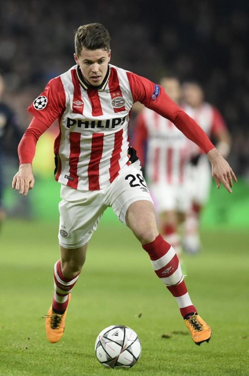 PSV Eindhoven's midfielder Marco van Ginkel runs with the ball during the UEFA Champions League round of 16 first leg football match between PSV Eindhoven and Atletico Madrid at the Philips Stadium in Eindhoven on February 24, 2016.   JOHN THYS / AFP
