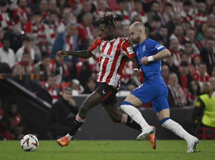 Athletic Bilbao's Spanish forward #10 Nico Williams fights for the ball with Rangers' Czech midfielder #18 Vaclav Cerny during the UEFA Europa League quarter final second leg football match between Athletic Club Bilbao and Glasgow Rangers, at the San Mames stadium in Bilbao on April 17, 2025.  ANDER GILLENEA / AFP