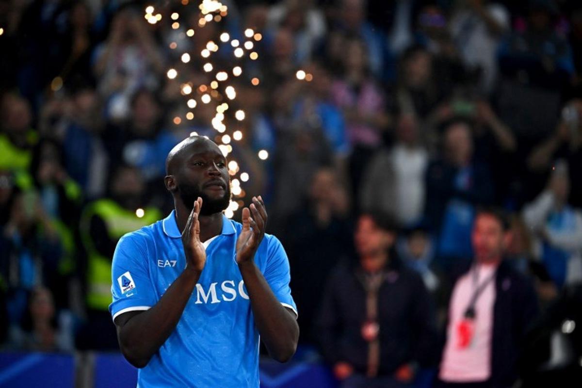 Napoli's Belgian forward #11 Romelu Lukaku applauds ahead of the trophy ceremony for the Italian Champions following the Italian Serie A football match between Napoli and Cagliari at the Diego Armando Maradona stadium in Naples on May 23, 2025.  Isabella BONOTTO / AFP
