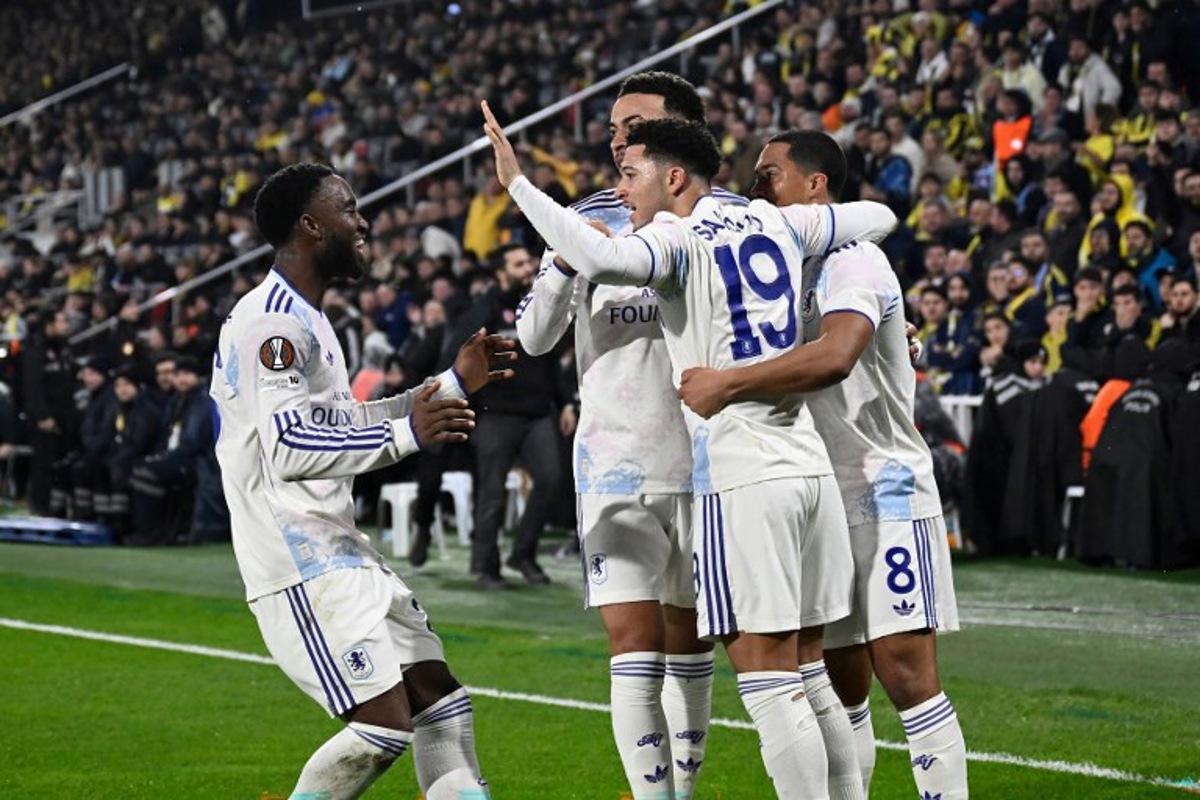 Aston Villa's  English defender #19 Jadon Sancho celebrates with teammates after scoring team's first goal during the UEFA Europa League 7 round day football match between Aston villa and Fenerbahce at the Chobani Stadium, Istanbul, on January 22, 2026.  Yasin AKGUL / AFP