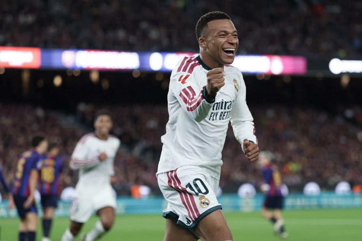 Real Madrid's French forward #10 Kylian Mbappe celebrates scoring his team's first goal during the Spanish league football match between FC Barcelona and Real Madrid CF at Camp Nou Stadium in Barcelona on October 25, 2026.  Lluis GENE / AFP