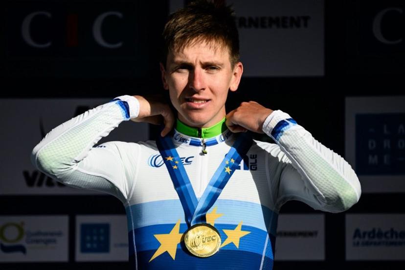 Slovenian rider Tadej Pogacar celebrates in the podium after winning the men's Elite Road Race at the European Cycling Championship 2025 near Valence, southeastern France on October 5, 2025.  JEFF PACHOUD / AFP