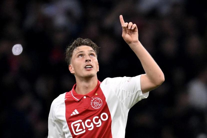 Ajax's Belgian forward #11 Mika Godts celebrates scoring his team' second goal during the UEFA Europa League football match between Ajax Amsterdam and Besiktas at The Johan Cruijff Arena Stadium in Amsterdam on September 26, 2024.  JOHN THYS / AFP